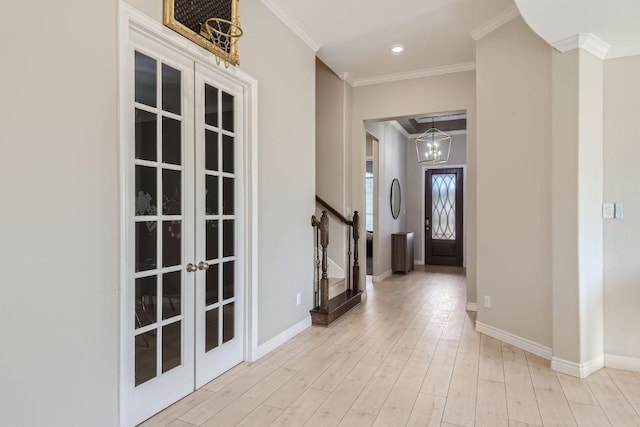 21808 Esmeralda Dr, Spicewood, TX 78669 - entrance foyer with french doors, ornamental molding, stairs, light wood-style flooring, and baseboards