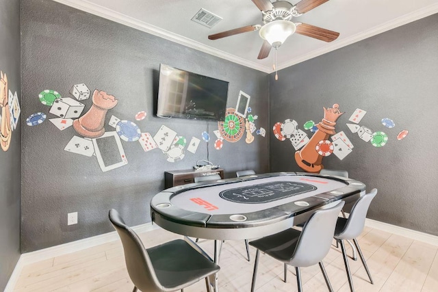 21808 Esmeralda Dr, Spicewood, TX 78669 - recreation room with wood finished floors, a ceiling fan, ornamental molding, baseboards, and a textured wall