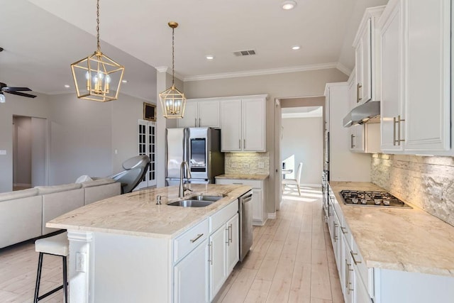 21808 Esmeralda Dr, Spicewood, TX 78669 - kitchen featuring a sink, stainless steel appliances, open floor plan, recessed lighting, and tasteful backsplash