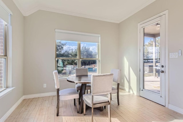 21808 Esmeralda Dr, Spicewood, TX 78669 - dining area featuring light wood-type flooring, crown molding, and baseboards