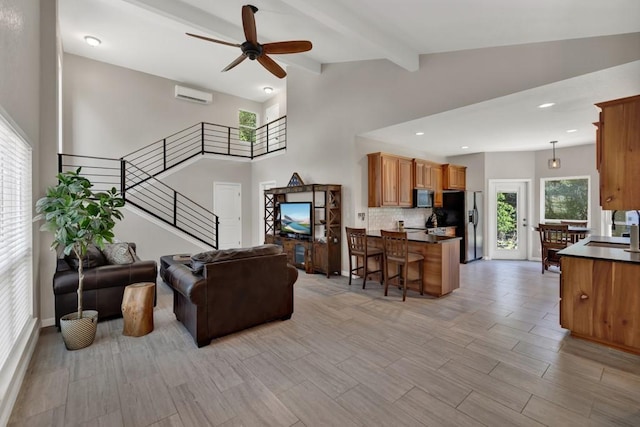 3055 Lakeview Dr, Canyon Lake, TX 78133 - living area featuring a wall mounted AC, a ceiling fan, stairway, beamed ceiling, and recessed lighting
