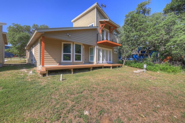 3055 Lakeview Dr, Canyon Lake, TX 78133 - rear view of property featuring a balcony, a yard, french doors, and a deck