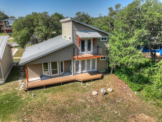 3055 Lakeview Dr, Canyon Lake, TX 78133 - back of property with french doors, a balcony, a lawn, and a wooden deck