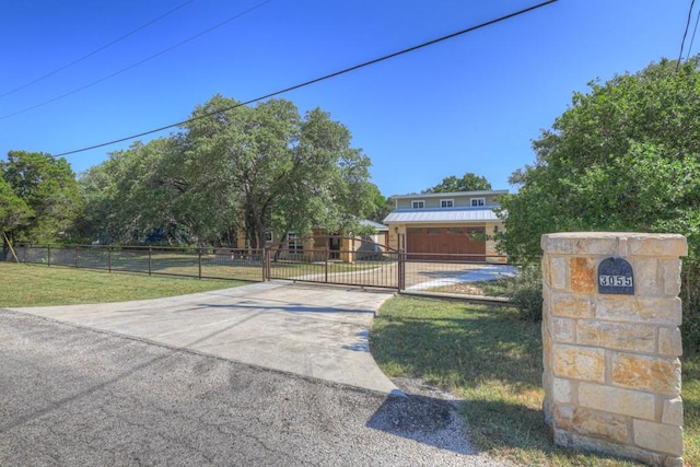 3055 Lakeview Dr, Canyon Lake, TX 78133 - view of front of home featuring a gate and concrete driveway