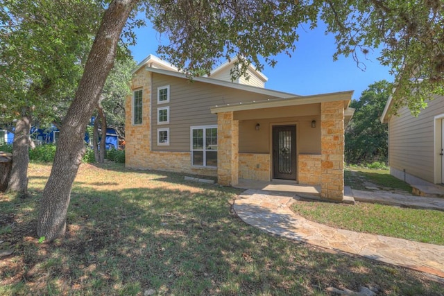 3055 Lakeview Dr, Canyon Lake, TX 78133 - mid-century home featuring stone siding and a front lawn