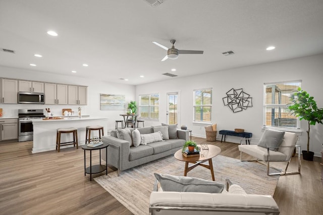 10208 Criswell Rd, Austin, TX 78754 - living area featuring recessed lighting, light wood-style floors, and ceiling fan
