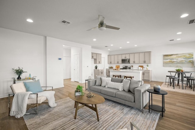10208 Criswell Rd, Austin, TX 78754 - living area with a ceiling fan, light wood finished floors, recessed lighting, and baseboards