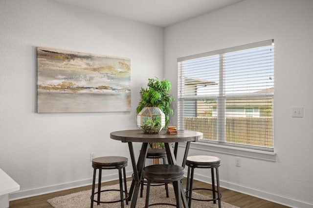 10208 Criswell Rd, Austin, TX 78754 - dining area featuring healthy amount of natural light, baseboards, and dark wood-type flooring