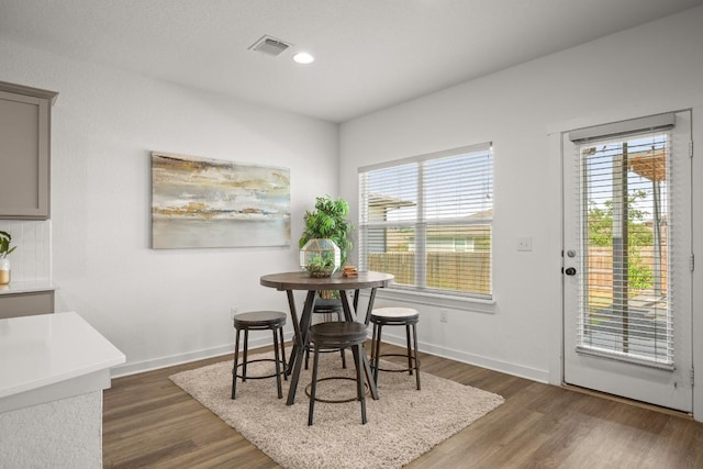 10208 Criswell Rd, Austin, TX 78754 - dining area with healthy amount of natural light, dark wood-style floors, baseboards, and recessed lighting