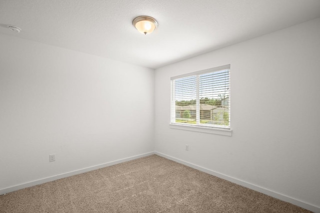10208 Criswell Rd, Austin, TX 78754 - carpeted empty room with baseboards and a smoke detector