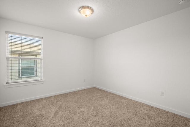 10208 Criswell Rd, Austin, TX 78754 - spare room with carpet flooring, baseboards, and a smoke detector