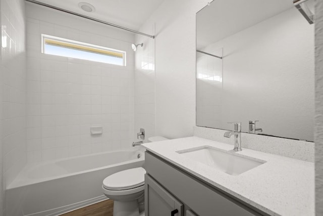 10208 Criswell Rd, Austin, TX 78754 - full bathroom with vanity, washtub / shower combination, and wood finished floors