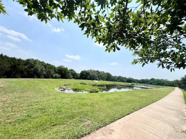 10016 Wading Pool Path, Austin, TX 78748 - view of green lawn featuring a water view