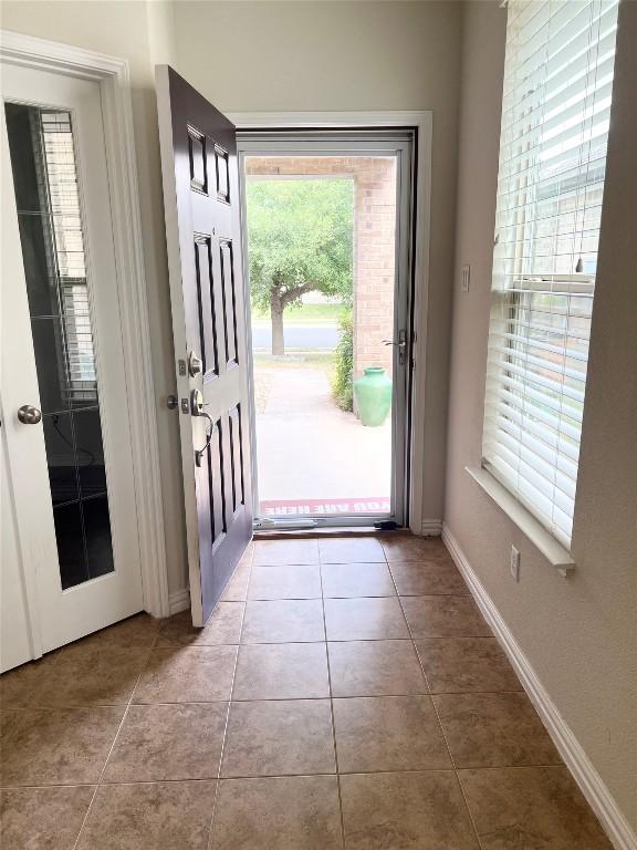 10016 Wading Pool Path, Austin, TX 78748 - foyer with tile patterned flooring and baseboards