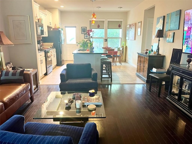 10016 Wading Pool Path, Austin, TX 78748 - living room with light wood finished floors, baseboards, and recessed lighting