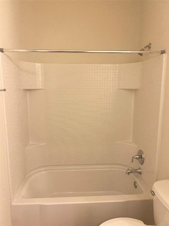 10016 Wading Pool Path, Austin, TX 78748 - bathroom featuring toilet and bathing tub / shower combination