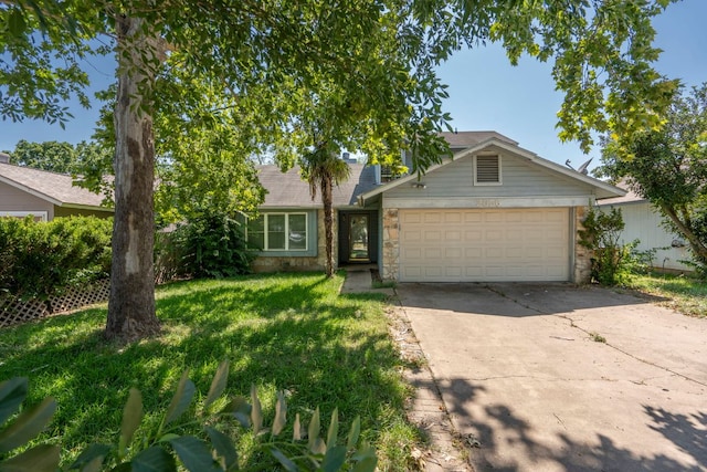 2656 Piping Rock Trl, Austin, TX 78748 - view of front facade with driveway, an attached garage, stone siding, and a front yard