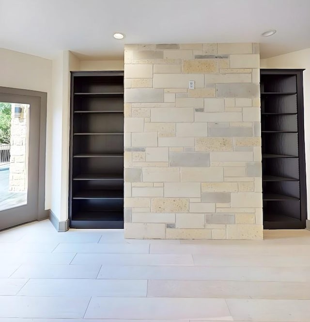 2700 Marina Shores Dr, Spicewood, TX 78669 - detailed view of baseboards and recessed lighting