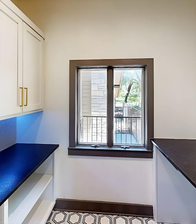 2700 Marina Shores Dr, Spicewood, TX 78669 - unfurnished dining area with baseboards