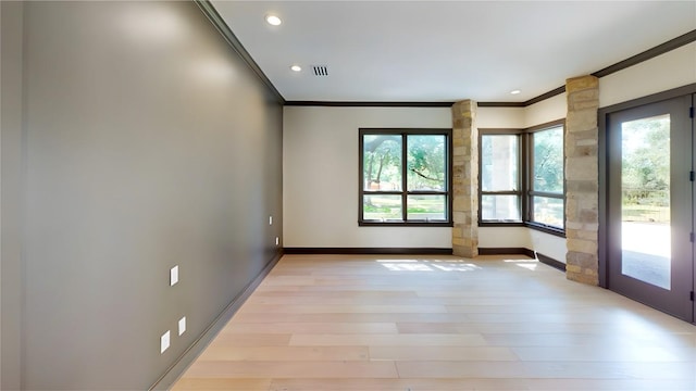 2700 Marina Shores Dr, Spicewood, TX 78669 - spare room with crown molding, healthy amount of natural light, light wood-type flooring, baseboards, and recessed lighting
