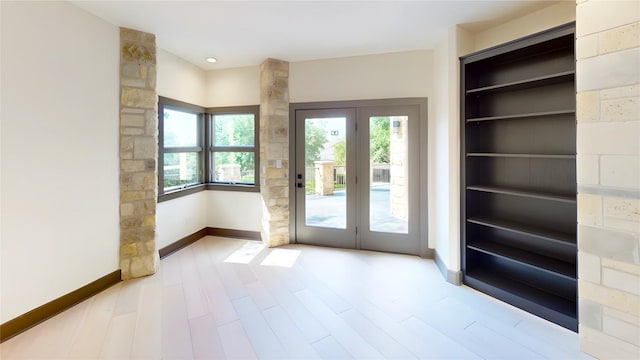 2700 Marina Shores Dr, Spicewood, TX 78669 - entryway featuring baseboards and wood finished floors