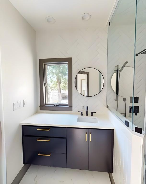 2700 Marina Shores Dr, Spicewood, TX 78669 - bathroom with vanity and marble finish floors