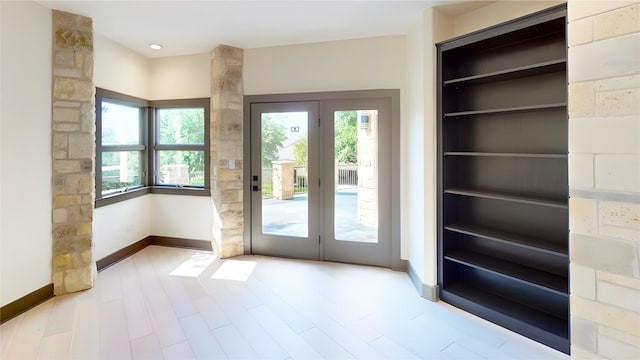 2700 Marina Shores Dr, Spicewood, TX 78669 - entryway featuring baseboards and wood finished floors