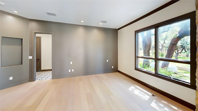 2700 Marina Shores Dr, Spicewood, TX 78669 - empty room featuring ornamental molding, light wood-type flooring, baseboards, and recessed lighting