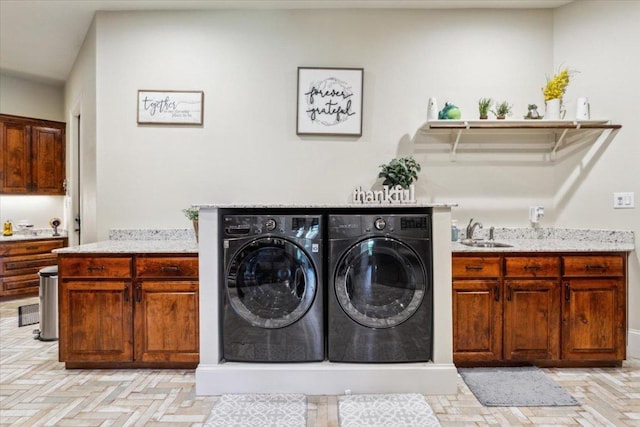 535 Creekside Dr, Salado, TX 76571 - laundry area with washer and clothes dryer and cabinet space
