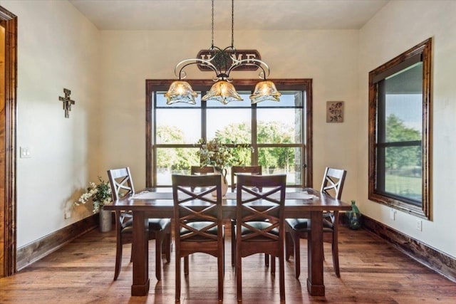 535 Creekside Dr, Salado, TX 76571 - dining room with wood finished floors, a chandelier, and baseboards