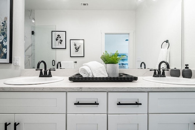 148 Feather Way, Fredericksburg, TX 78624 - full bathroom with double vanity and a shower stall