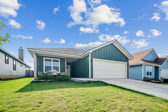 148 Feather Way, Fredericksburg, TX 78624 - view of front of property with an attached garage, board and batten siding, and driveway