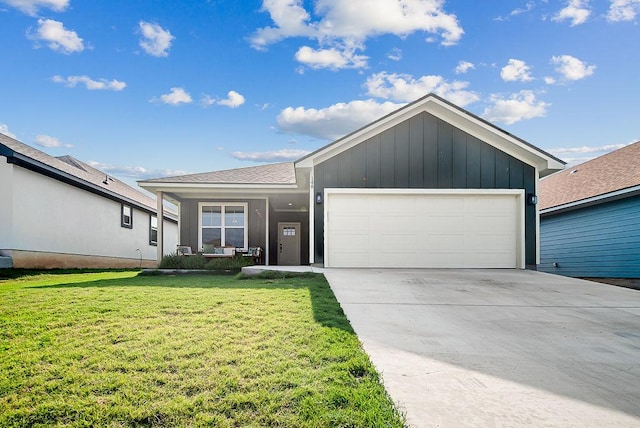 148 Feather Way, Fredericksburg, TX 78624 - single story home with board and batten siding, a garage, a front lawn, and driveway