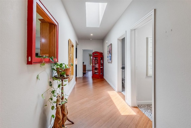 408 Sombrero, Horseshoe Bay, TX 78657 - hall with a skylight and light wood-type flooring