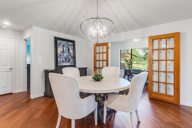 408 Sombrero, Horseshoe Bay, TX 78657 - dining space featuring a chandelier, wood finished floors, vaulted ceiling, and french doors