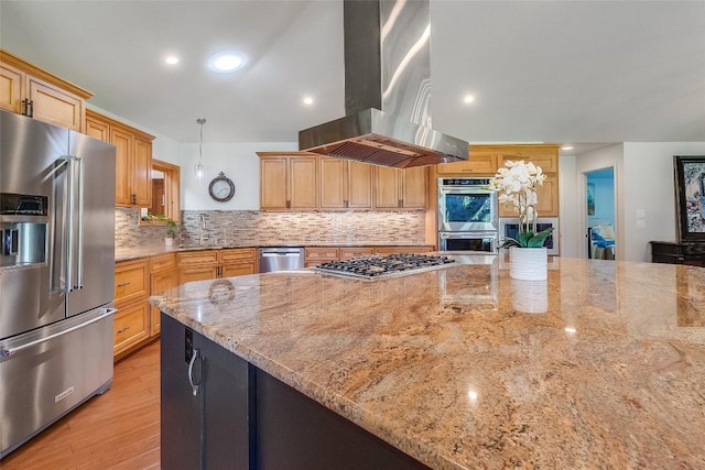 408 Sombrero, Horseshoe Bay, TX 78657 - kitchen featuring stainless steel appliances, extractor fan, light stone counters, decorative backsplash, and light wood-style flooring