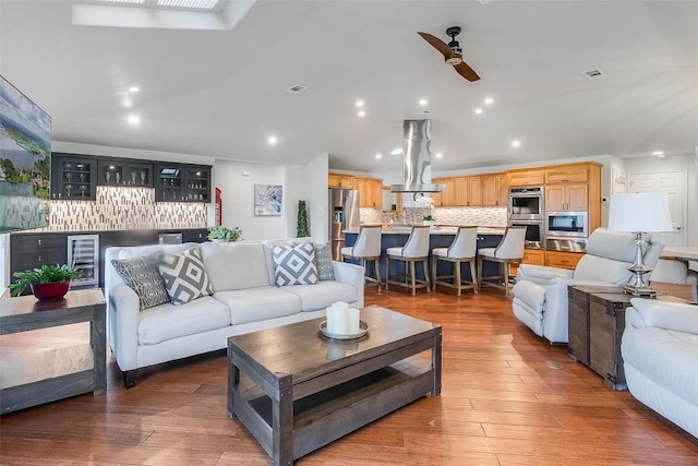408 Sombrero, Horseshoe Bay, TX 78657 - living area featuring a dry bar, a ceiling fan, beverage cooler, recessed lighting, and wood finished floors