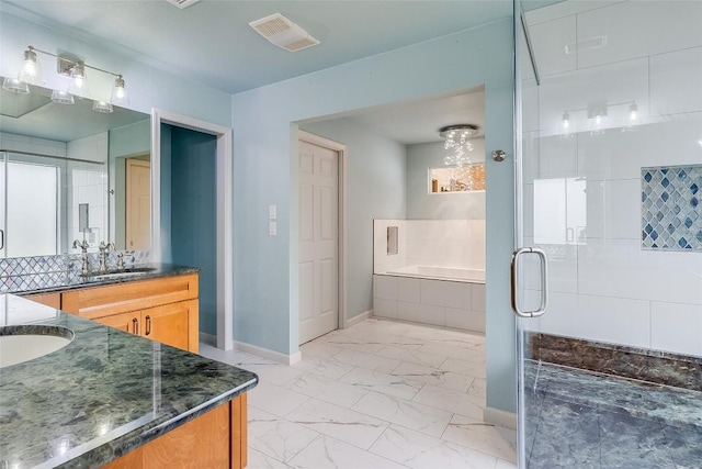 408 Sombrero, Horseshoe Bay, TX 78657 - full bathroom with vanity, marble look tile flooring, a bath, and a stall shower