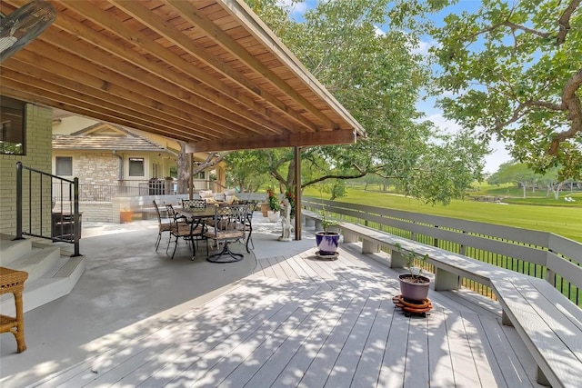 408 Sombrero, Horseshoe Bay, TX 78657 - wooden deck with outdoor dining space