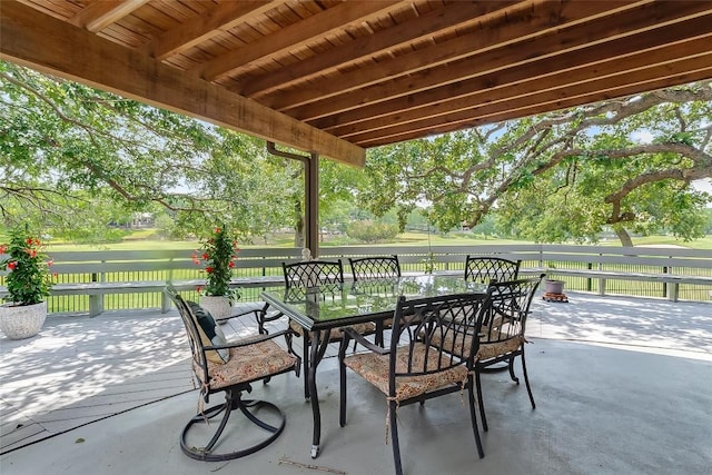 408 Sombrero, Horseshoe Bay, TX 78657 - view of patio / terrace featuring outdoor dining space and view of wooded area