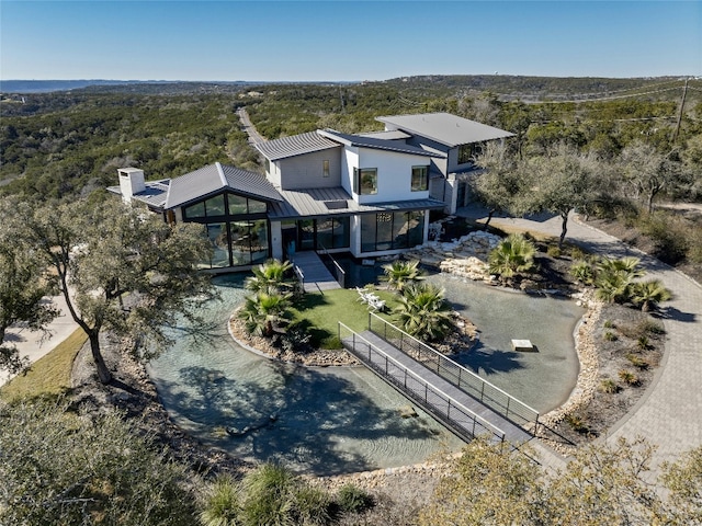 8209 Two Coves Dr, Austin, TX 78730 - view of subject property with a forest