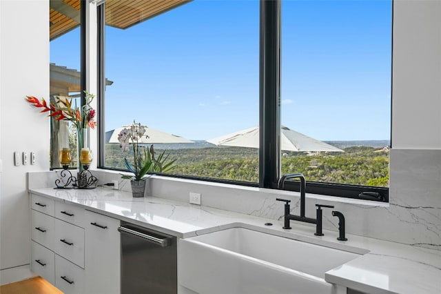 8209 Two Coves Dr, Austin, TX 78730 - kitchen with a sink, white cabinetry, light stone counters, and plenty of natural light