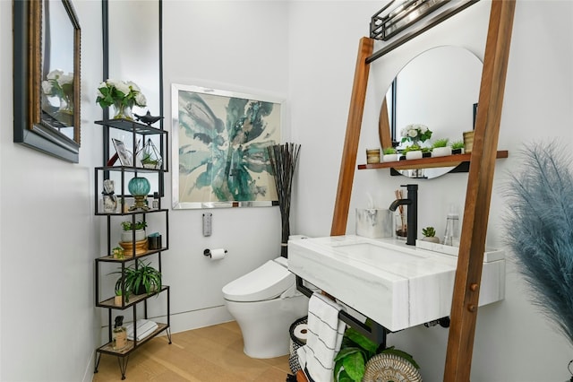 8209 Two Coves Dr, Austin, TX 78730 - half bath featuring toilet and wood finished floors