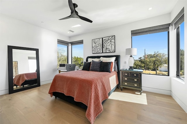 8209 Two Coves Dr, Austin, TX 78730 - bedroom with light wood-type flooring, ceiling fan, and baseboards