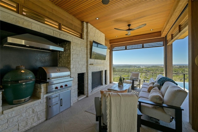 8209 Two Coves Dr, Austin, TX 78730 - view of patio / terrace with a ceiling fan and an outdoor living space with a fireplace