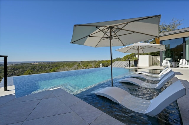 8209 Two Coves Dr, Austin, TX 78730 - view of pool with an infinity pool and a patio area