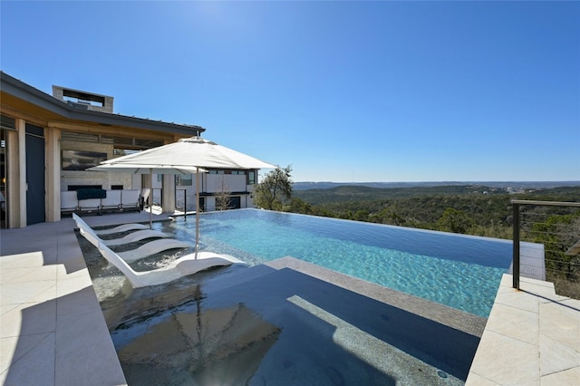 8209 Two Coves Dr, Austin, TX 78730 - view of pool with an infinity pool, a patio, and a gazebo