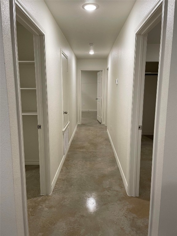 2313 Zanoletti Ct, Temple, TX 76504 - hall with finished concrete flooring and baseboards