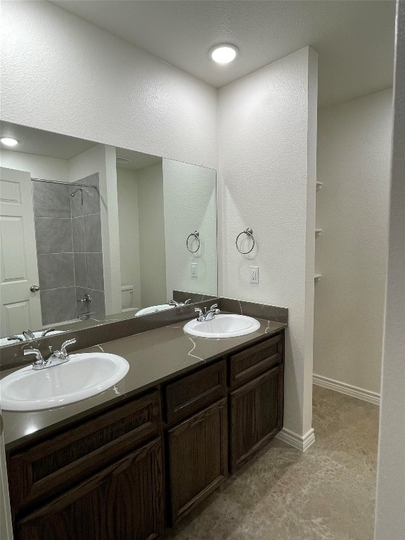 2313 Zanoletti Ct, Temple, TX 76504 - bathroom with double vanity, toilet, and shower / tub combination