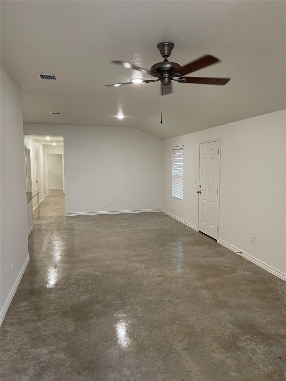 2313 Zanoletti Ct, Temple, TX 76504 - empty room featuring finished concrete floors, ceiling fan, baseboards, and lofted ceiling